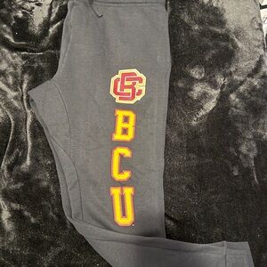 Nike black Joggers with Red and Yellow Accents